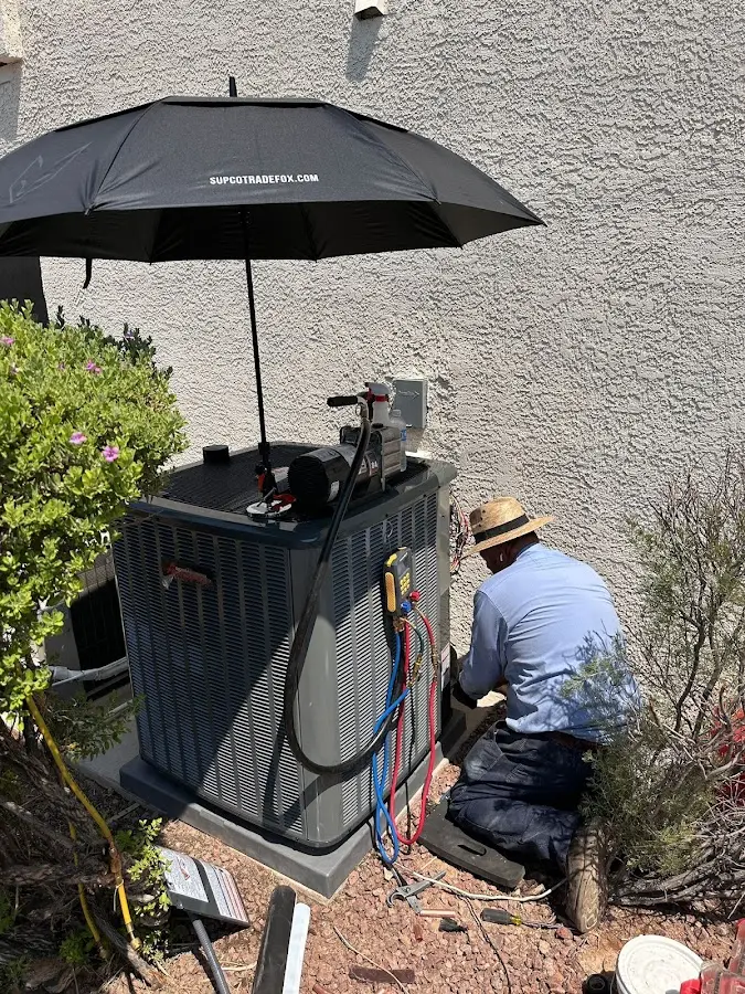HVAC technician performing outdoor AC maintenance in Manhattan